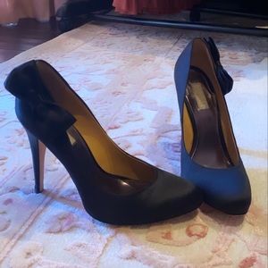 Badgley Mischka black satin pumps.